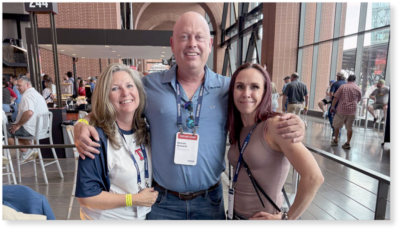 Dennis with two CEOs at baseball game