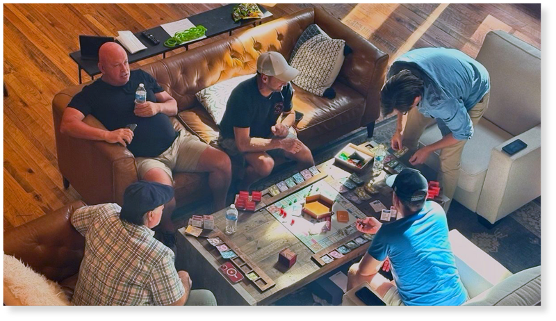 Group of CEOs playing Monopoly
