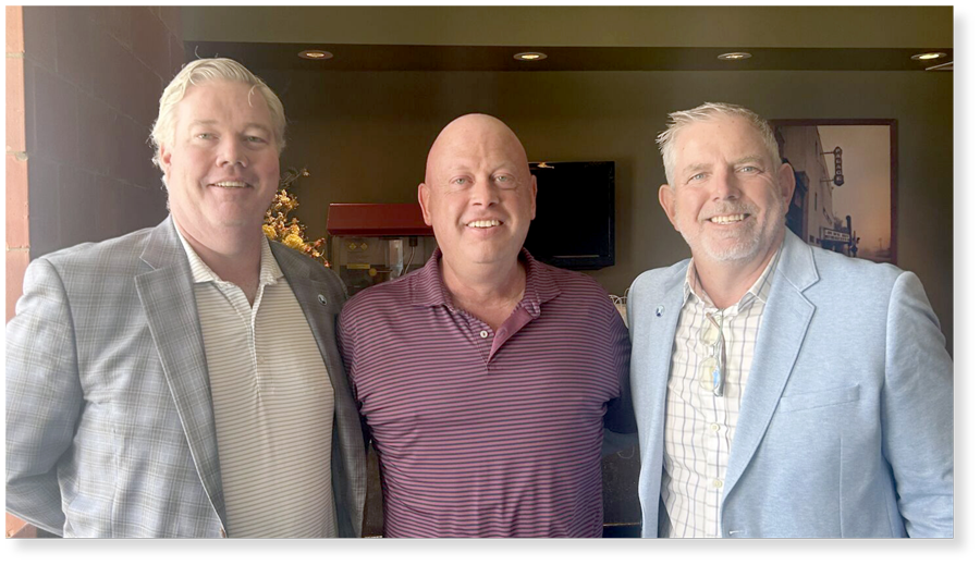 Dennis with a couple of CEOs at convention