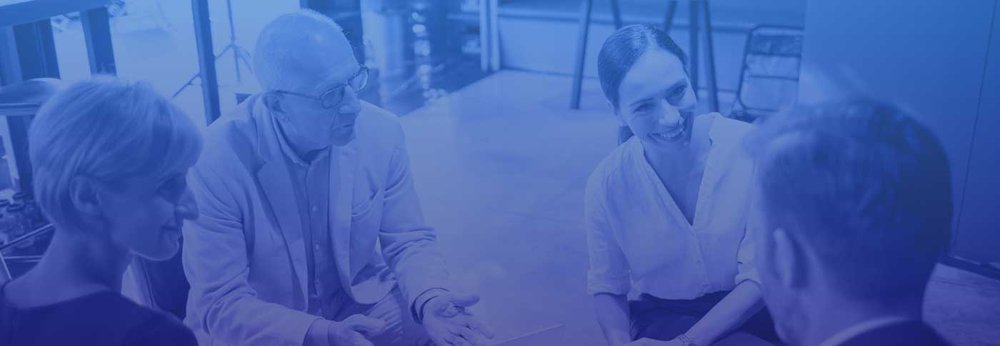 Group of CEOs sitting having coffee