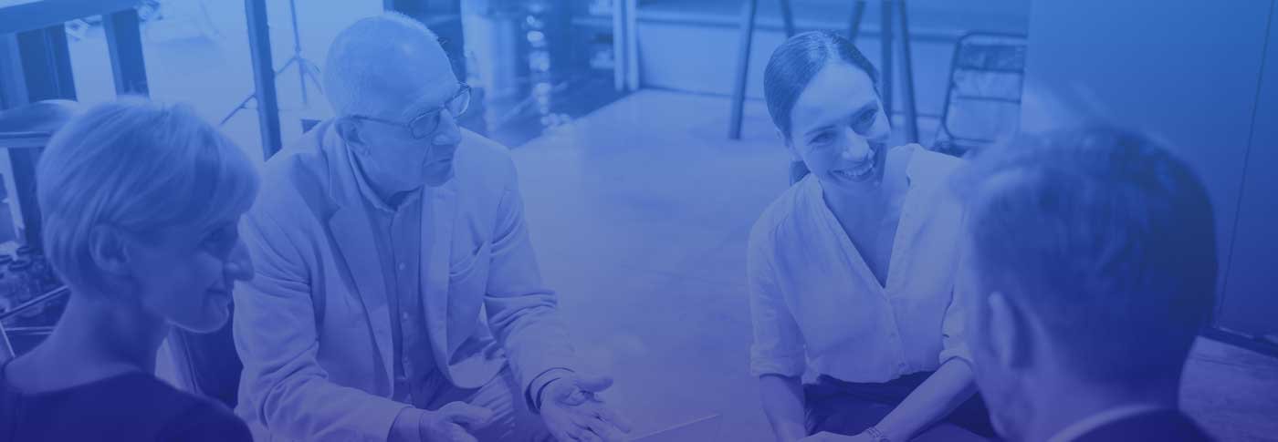 Group of CEOs sitting having coffee